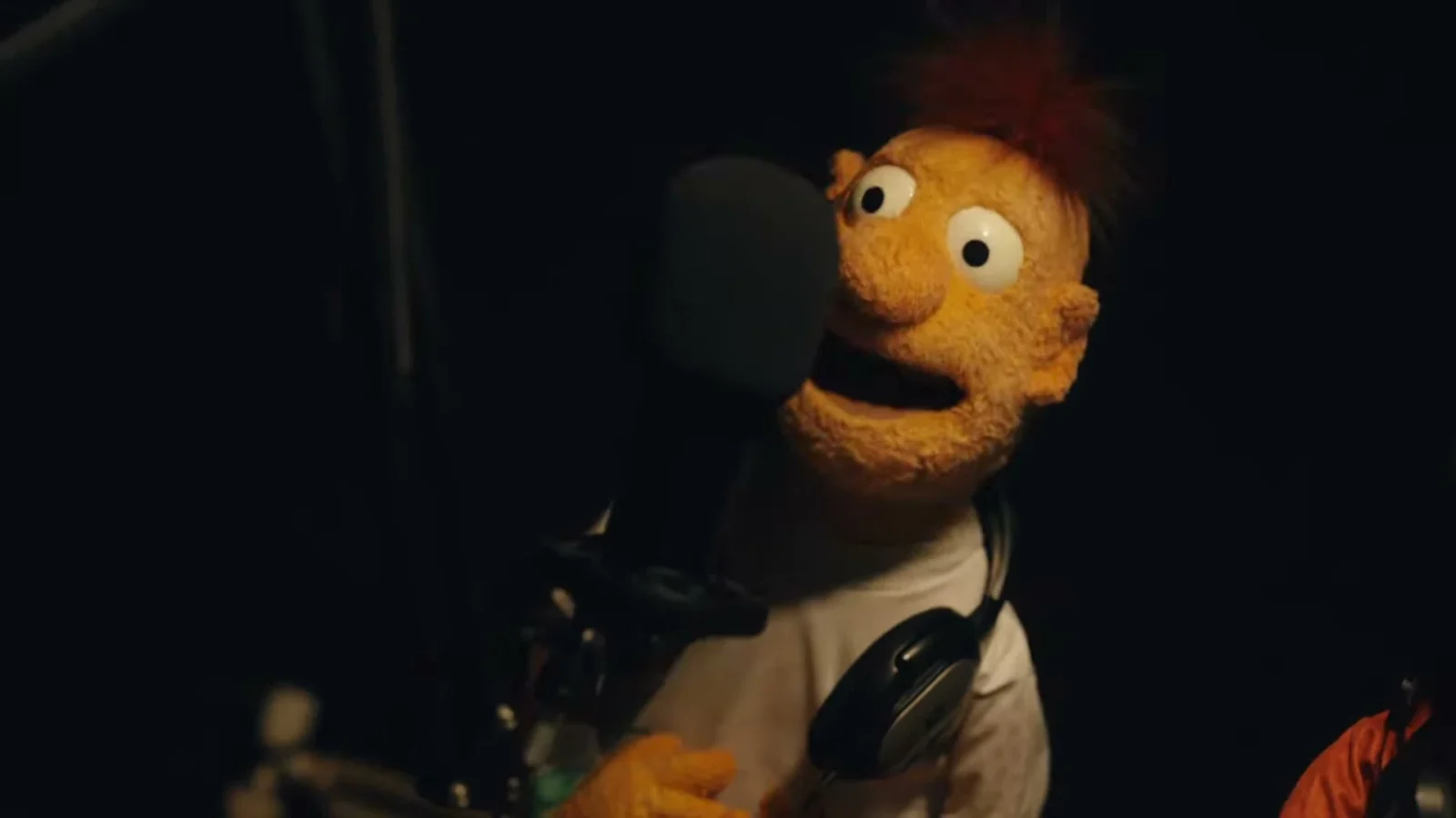 A puppet character in a recording studio