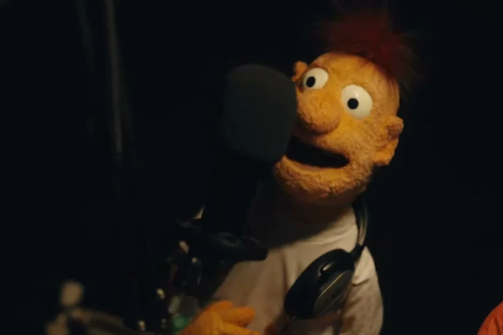 A puppet character in a recording studio